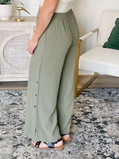 Linen Pants With Button Detail And Side Tassel String