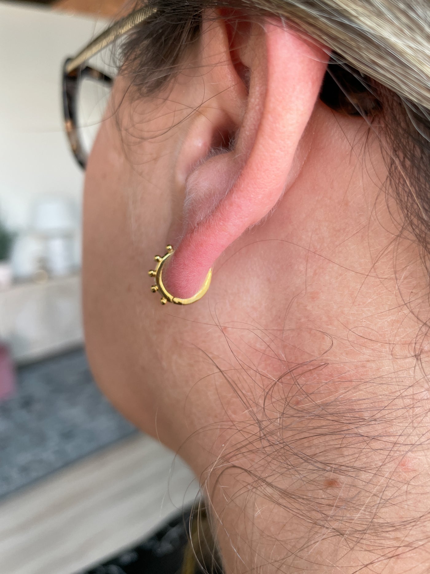 The Mini Hoop Huggies Earrings in Gold